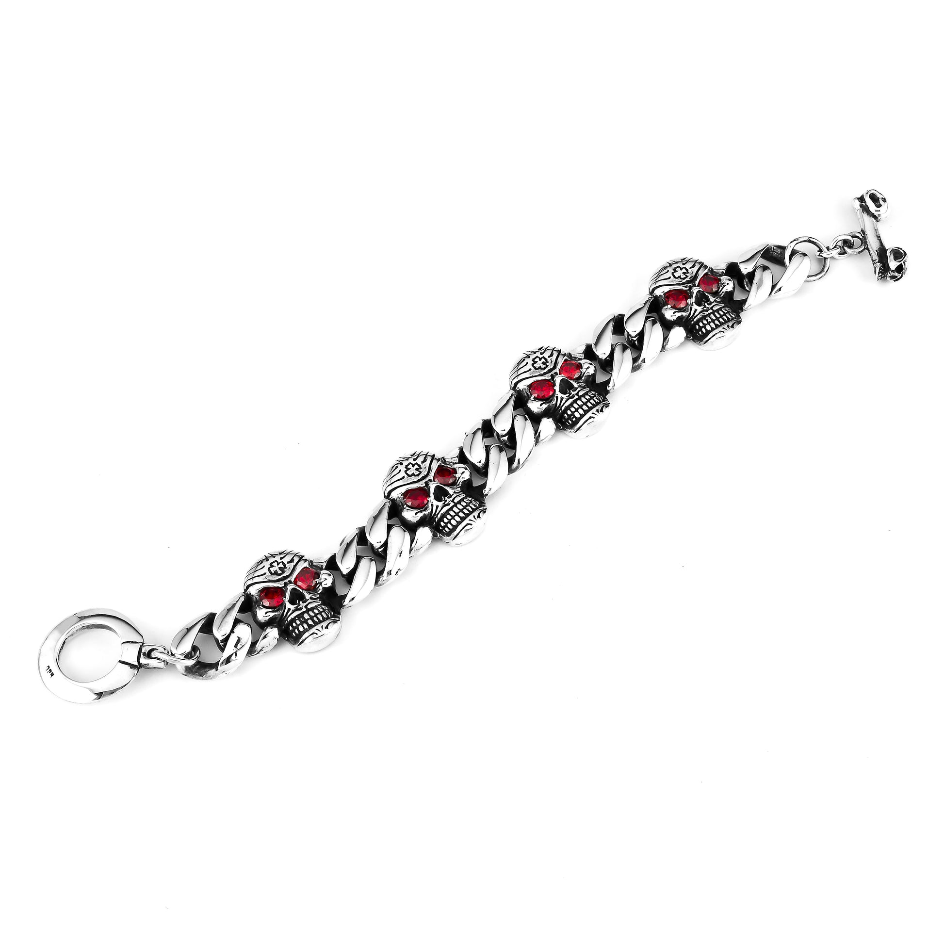 925 silver chain bracelet with engraved Mexican silver skulls and garnet eyes lengthwise with a double headed skull closure